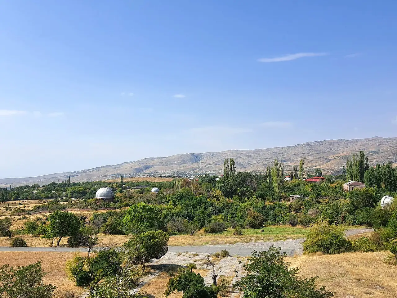 The white dome and Schmidt telescope of Byurakan Astrophysical Observatory on the slope of Aragats