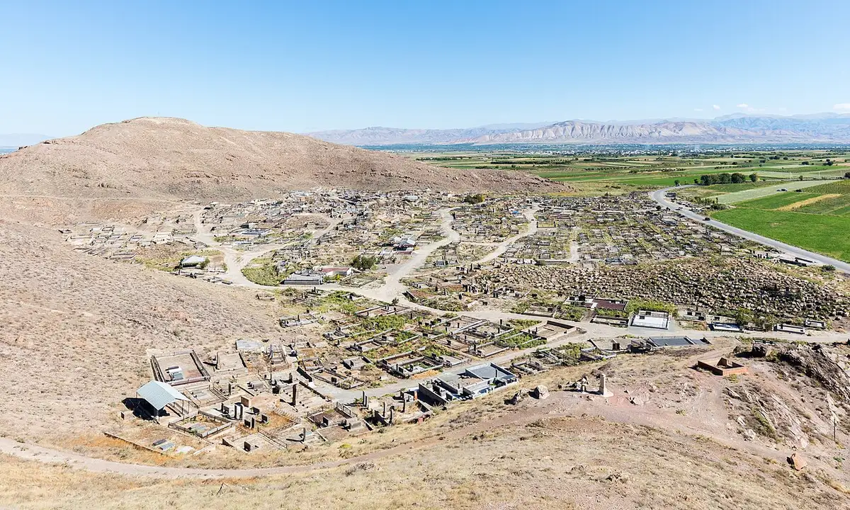Khor Virap monastery on its low hill with Mount Ararat filling the sky behind the Ararat plain