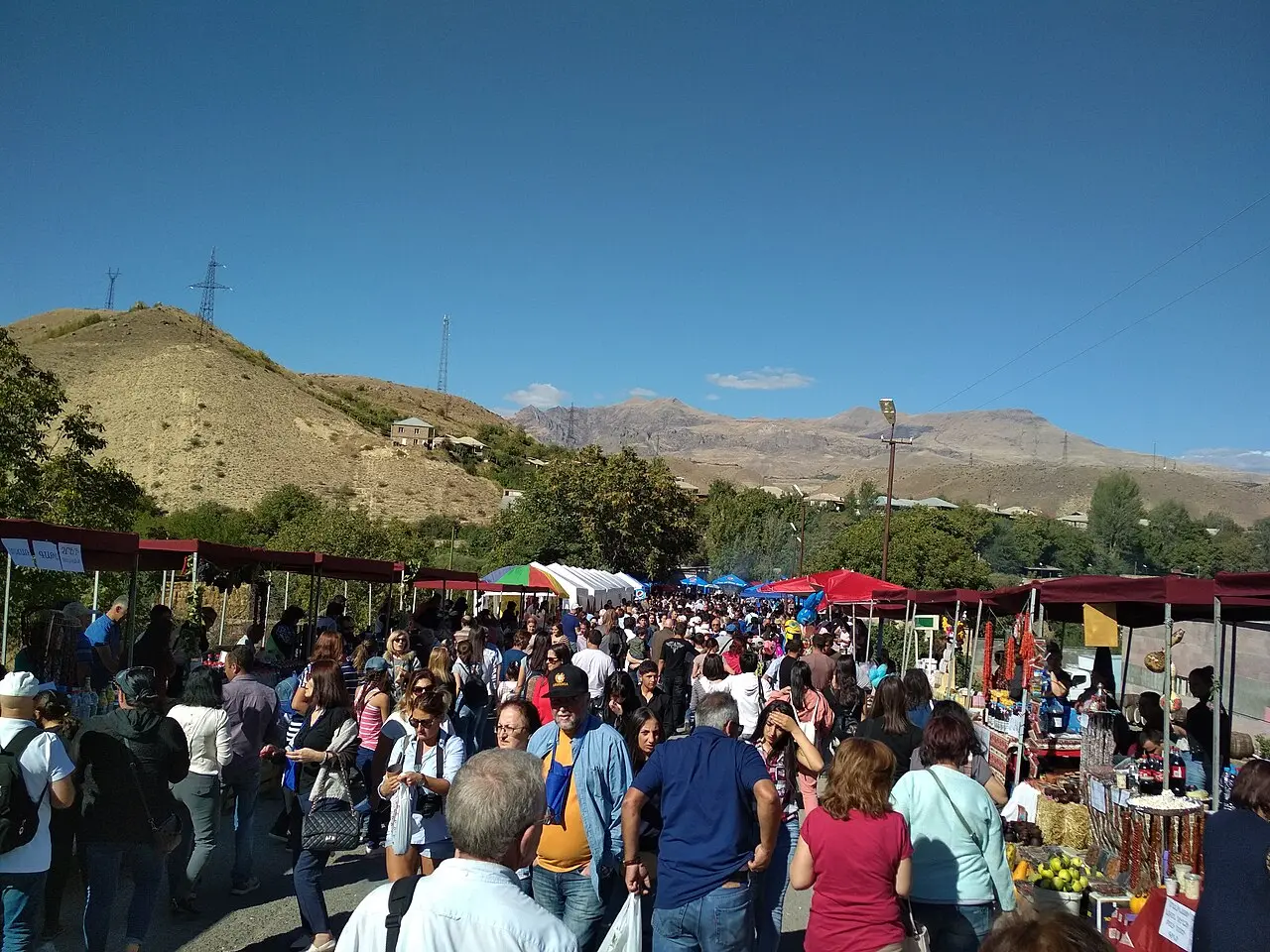 People around the grape-crushing area at the Areni Wine Festival in Vayots Dzor
