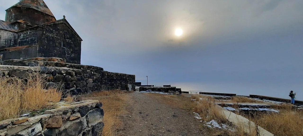 The Sevanavank monastery churches on a green peninsula above the blue expanse of Lake Sevan in Armenia