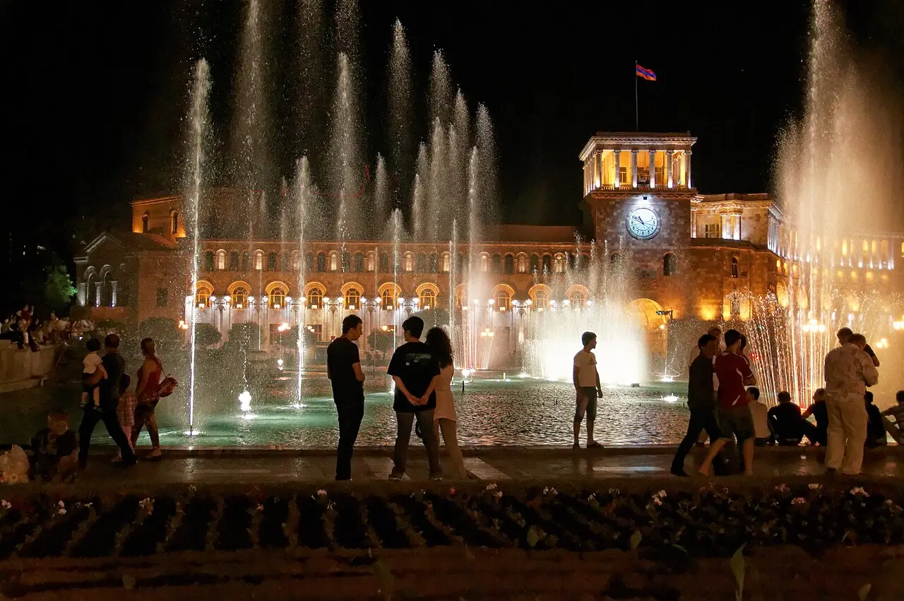 The musical fountains lit up in front of the government building on Republic Square in Yerevan at night