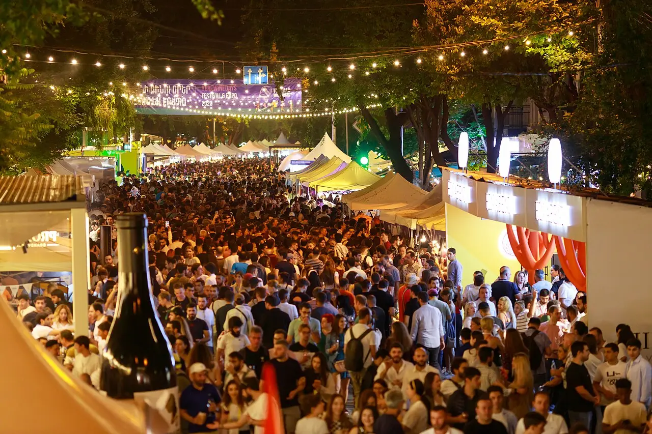 The Yerevan Wine Days street festival lit up at night with crowds and wine stalls