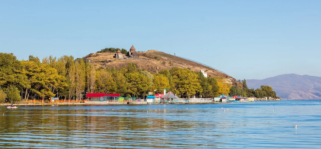 The Sevan peninsula with its monastery on the hill seen across the blue water of the lake