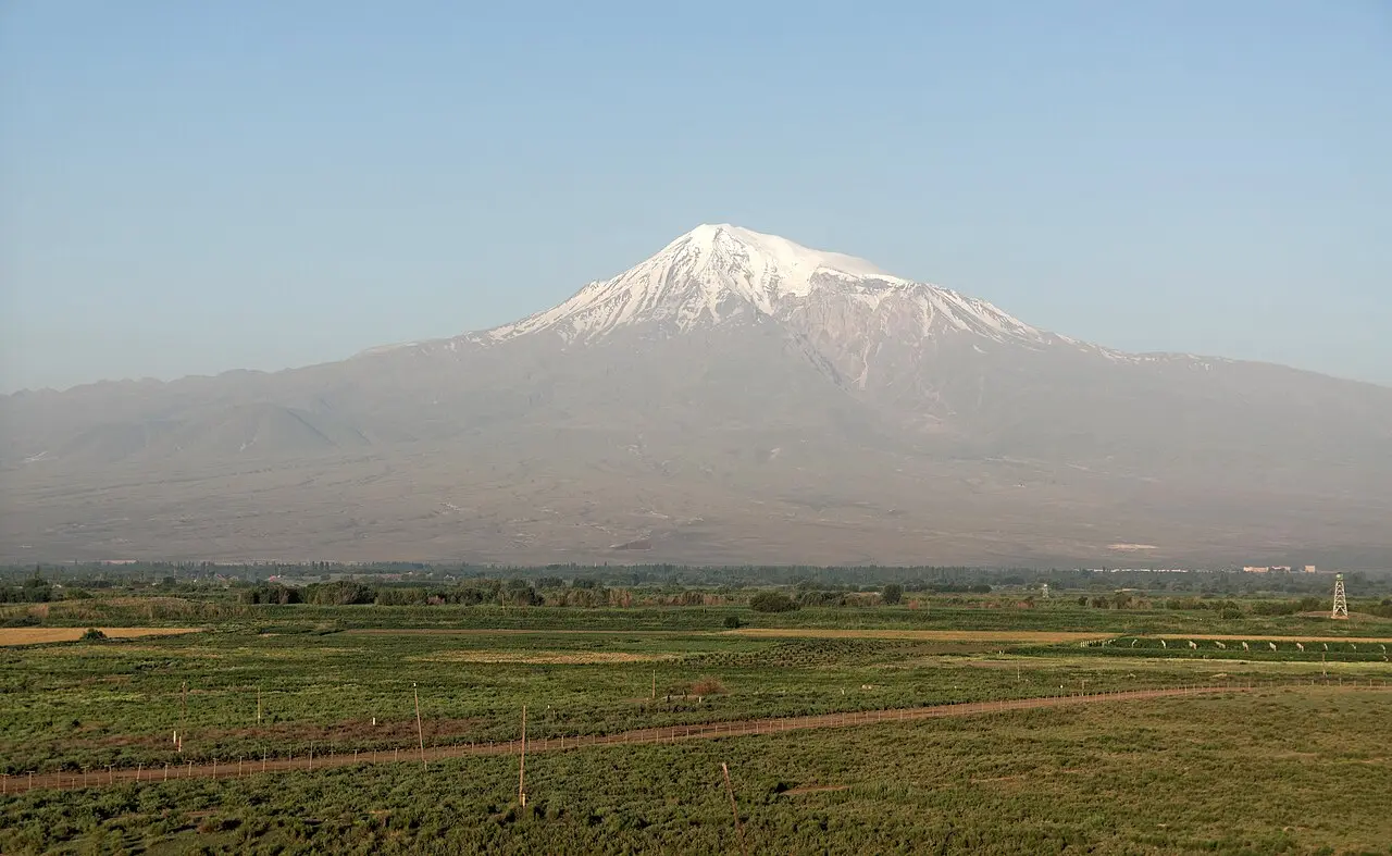 Mount Ararat rising above the Ararat plain with vineyards and fields in the foreground