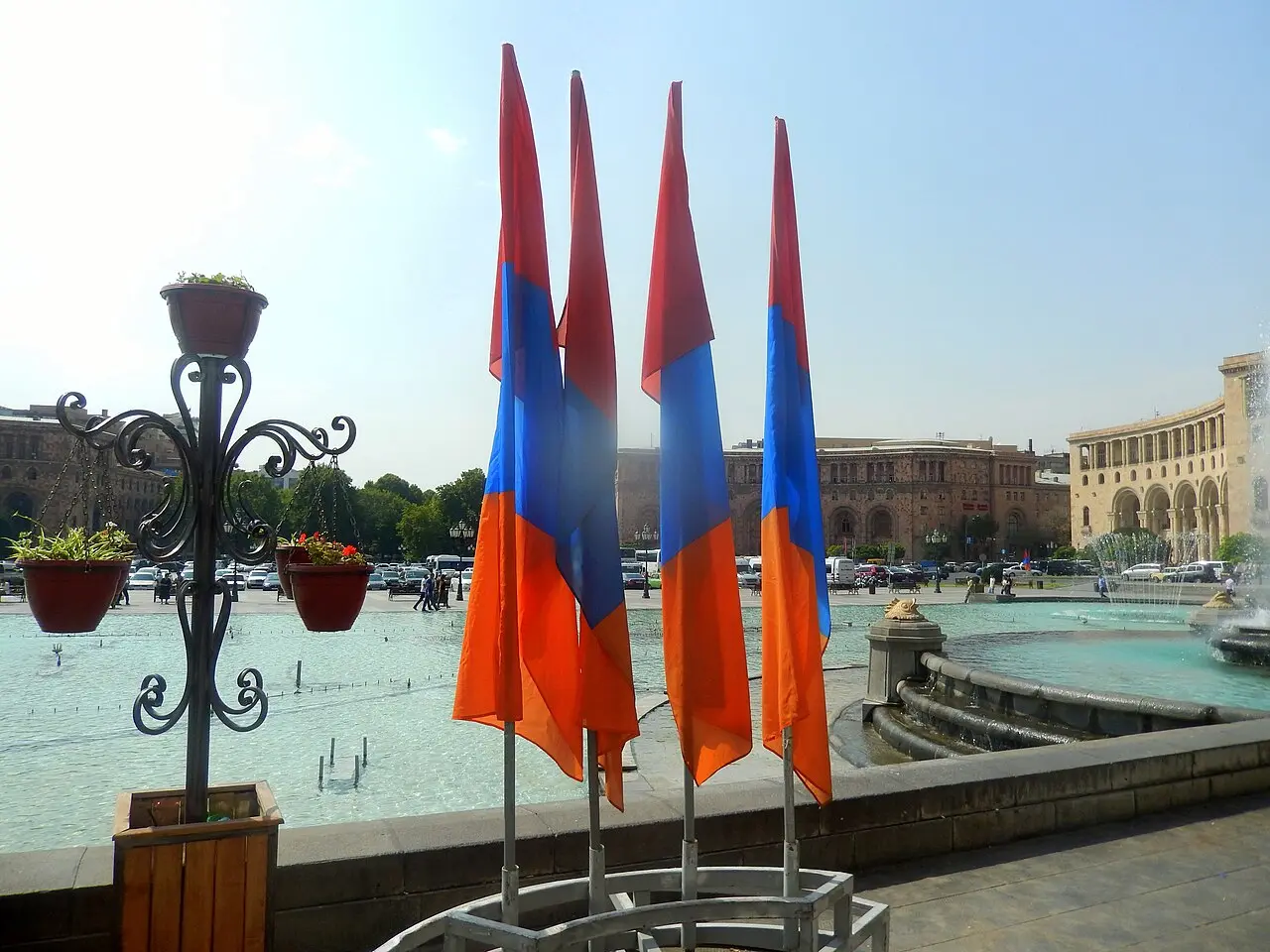 Armenian tricolour flags standing by the fountains on Republic Square in Yerevan