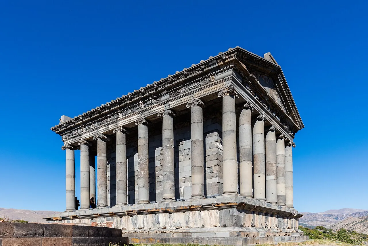 The colonnaded Greco-Roman temple of Garni standing against a deep blue sky in Kotayk province