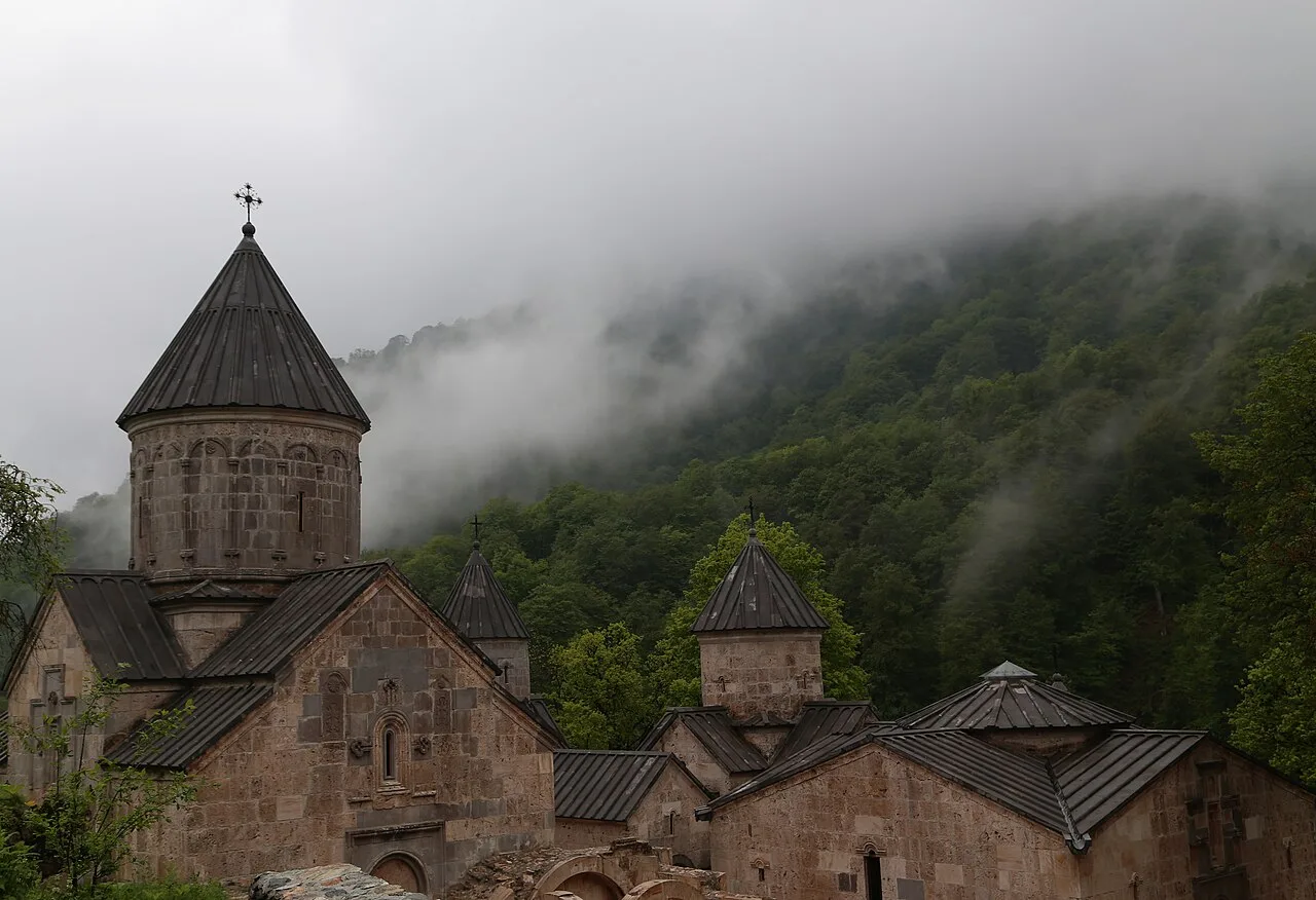 Haghartsin monastery cluster among misty green forest above Dilijan in Tavush province