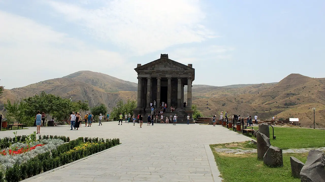 The colonnaded Hellenistic temple at Garni standing on a cliff terrace above a green gorge in central Armenia
