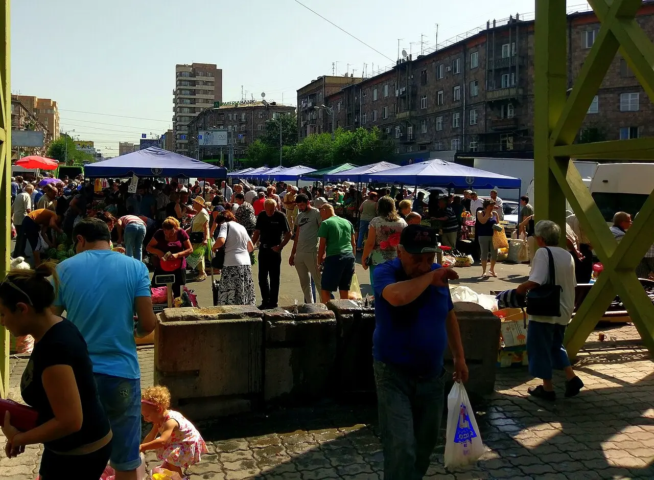 Stalls piled with fruit and vegetables at a farmers market in Yerevan