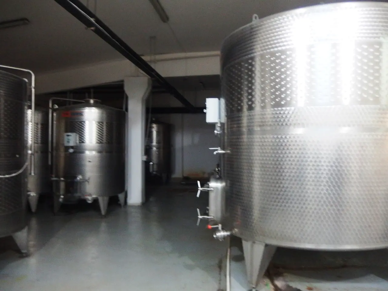 The Hin Areni winery building among vines in the village of Areni