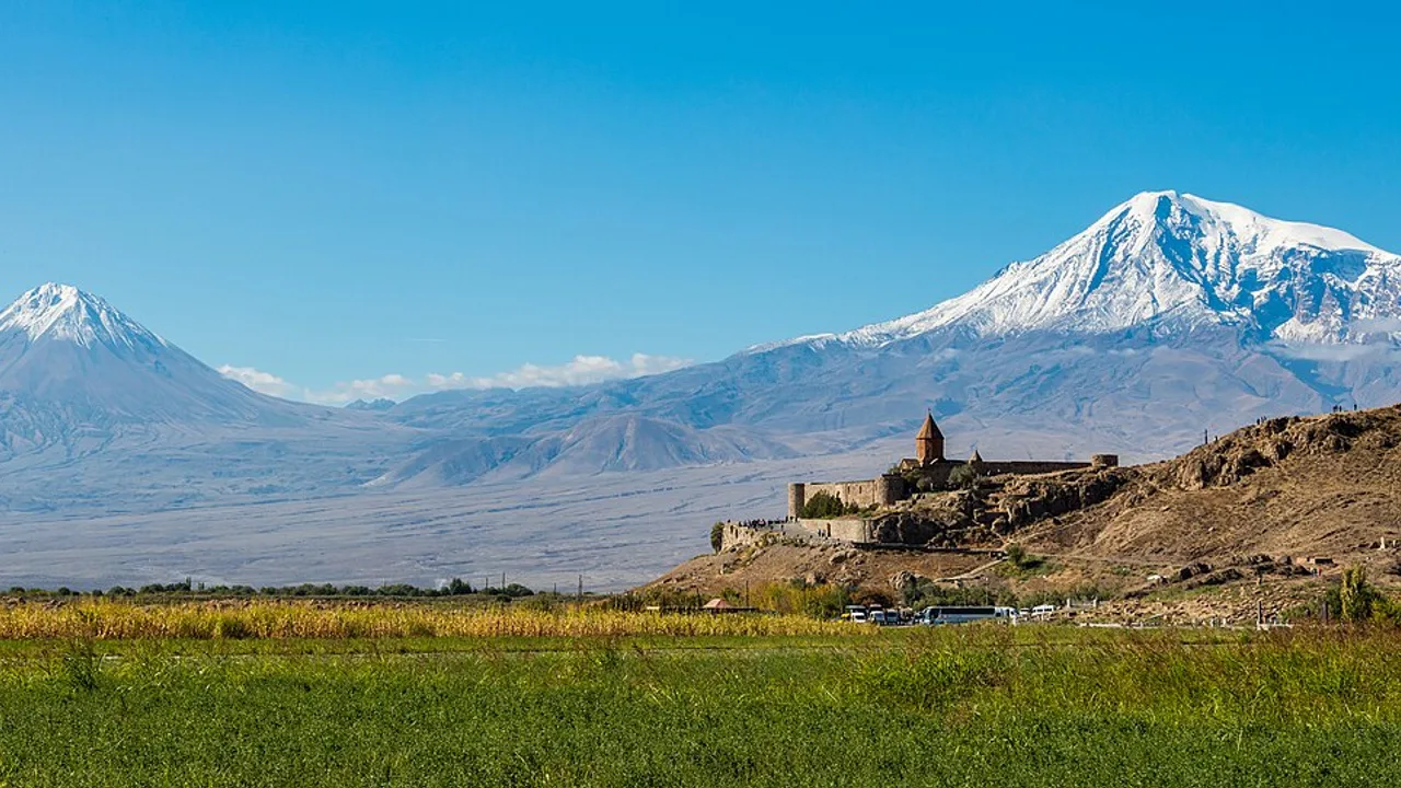Wide view of Khor Virap monastery on the Ararat plain with the twin peaks of Mount Ararat filling the skyline