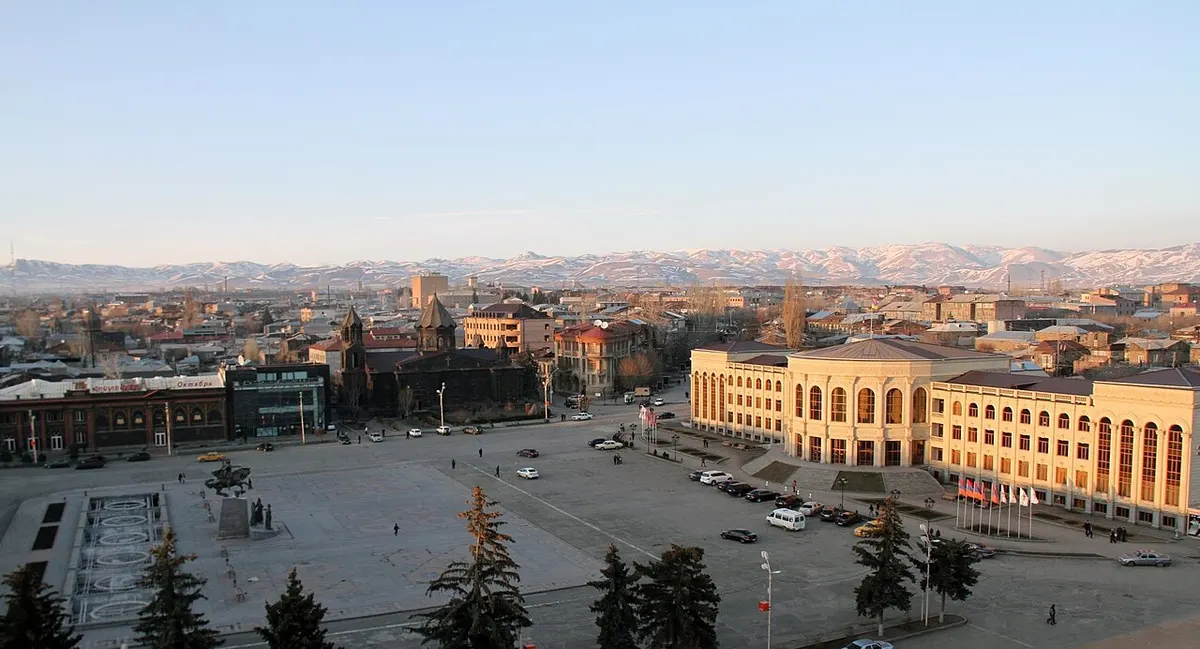 General view across Gyumri from the central square toward black-tuff churches and Soviet-era buildings
