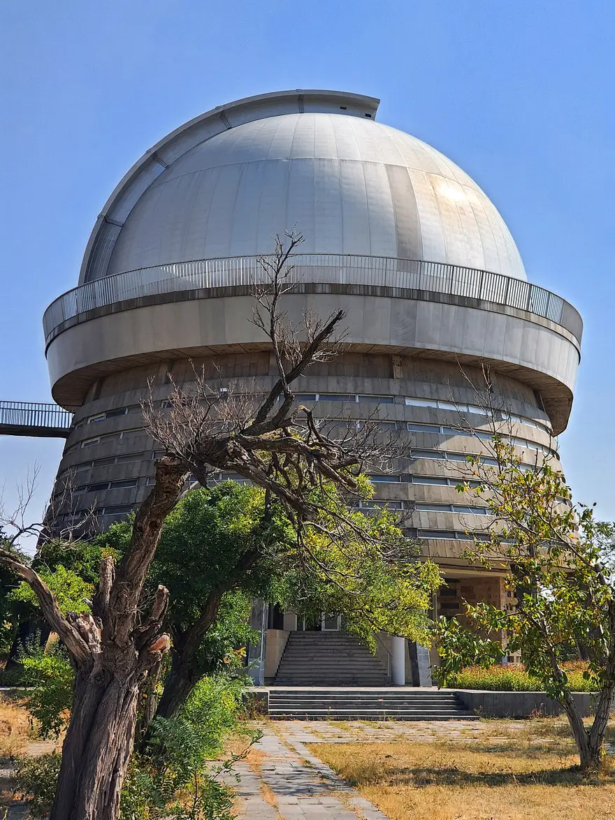 The domed tower of the 2.6 m ZTA telescope at Byurakan Observatory above the tree line