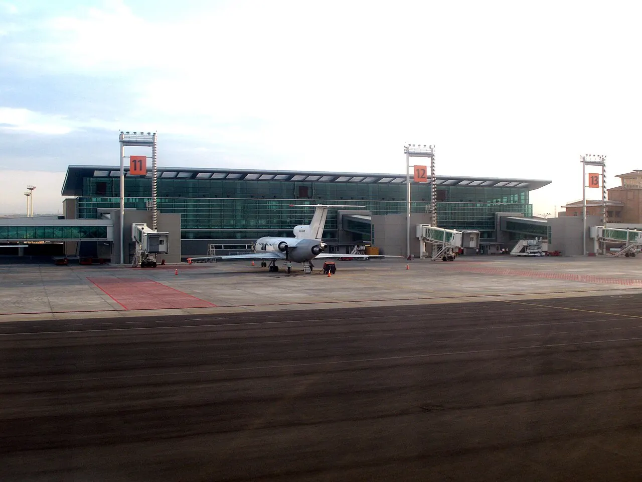 Airside at Zvartnots: apron, a parked aircraft, gates 11-13 and jet bridges