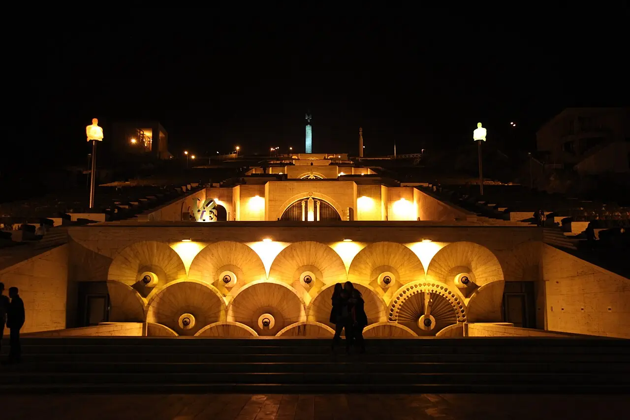 The Yerevan Cascade lit at night, its terraces glowing above the dark city