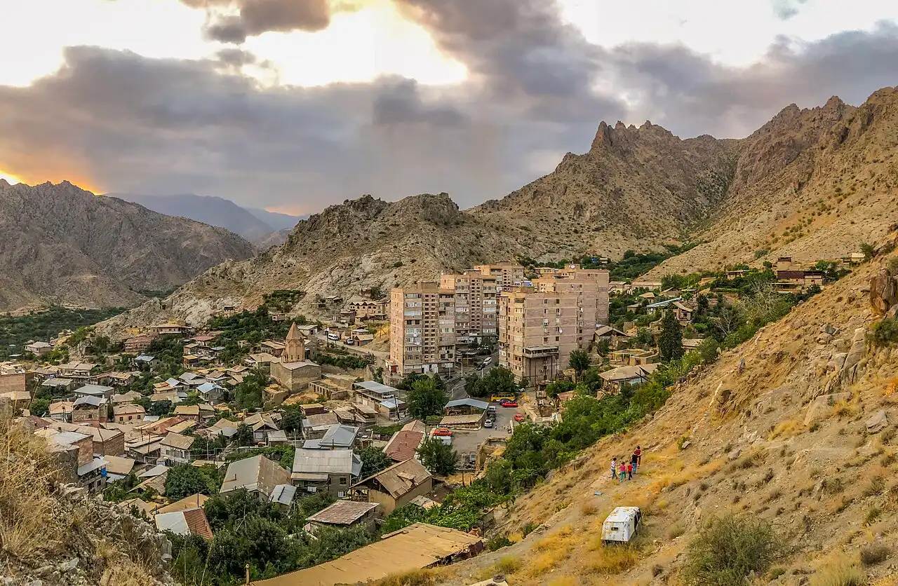 Panorama of Meghri with the Holy Mother of God church and dry Syunik mountains behind