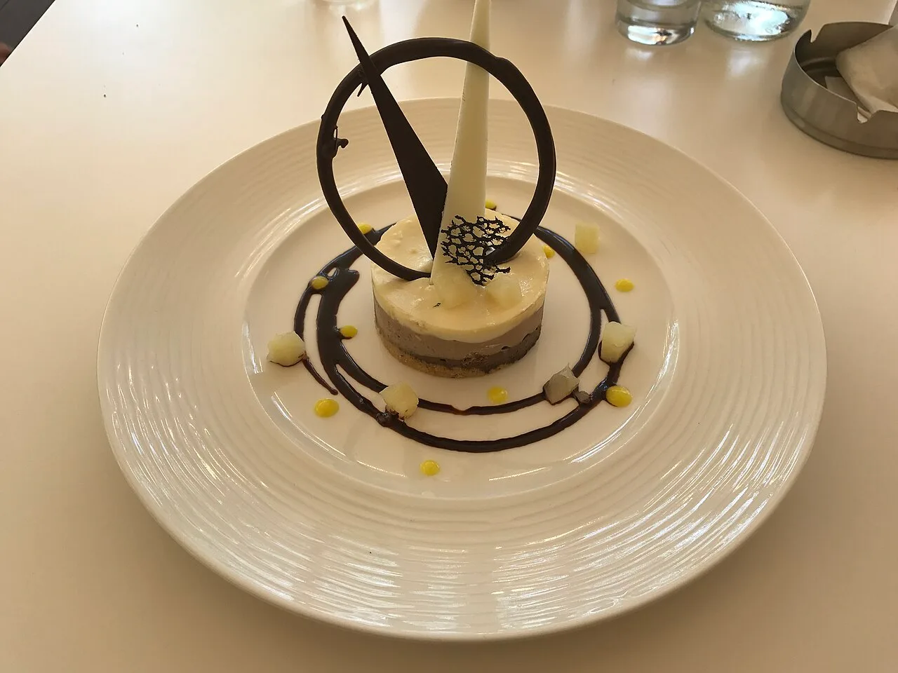 A carefully plated dessert at a restaurant table in Yerevan