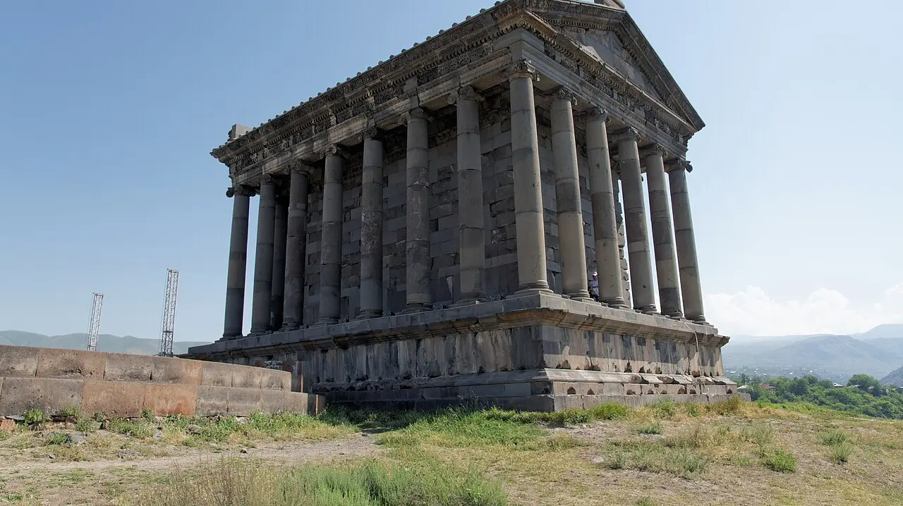 The colonnaded Greco-Roman temple of Garni standing on its plateau above the Azat river gorge under a clear sky