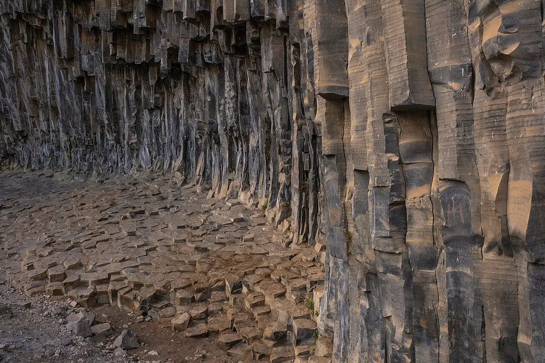The Symphony of Stones: tall hexagonal basalt columns hanging over the floor of the Garni gorge, resembling the pipes of an organ