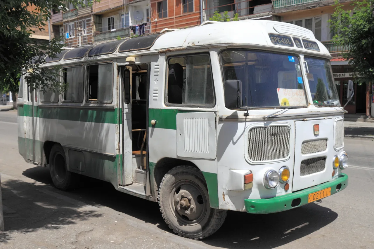 An old Soviet PAZ bus parked on a street in Vagharshapat, the kind still used on some Armenian regional routes
