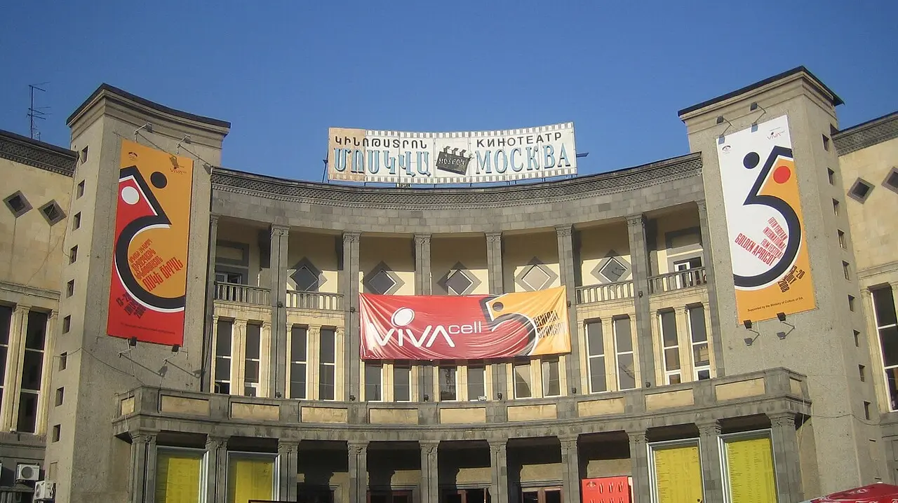 The Moscow Cinema in Yerevan hung with Golden Apricot festival banners under a clear blue sky