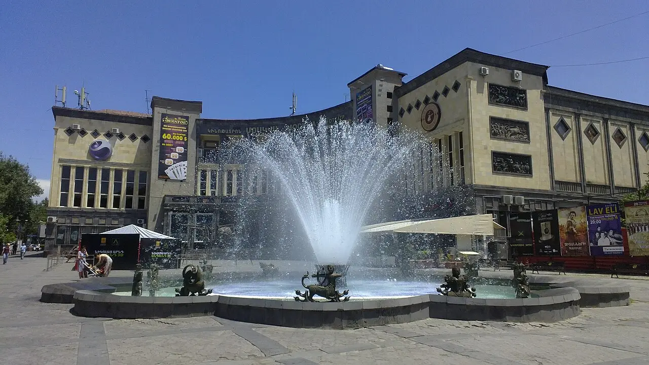 The Moscow Cinema in central Yerevan with its bronze fountain playing in front on a summer day