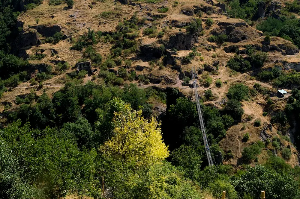 The Khor Dzor gorge at Khndzoresk seen from the suspension bridge, cave homes dotting the far wall