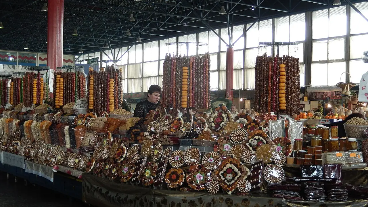 Colourful stalls of dried apricots, nuts and candied fruit under the roof of GUM Market in Yerevan