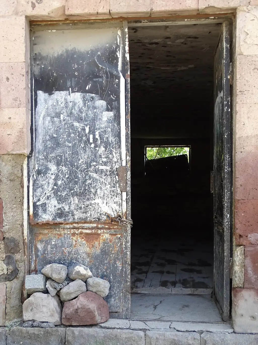 The cracked doorway of a building in Gyumri damaged in the 1988 Spitak earthquake