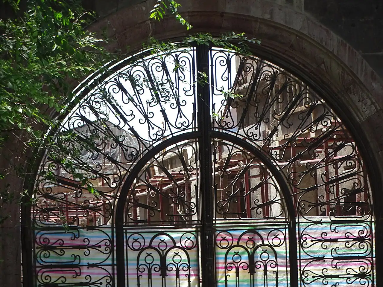 An ornate carved stone architectural detail on an old merchant house in Gyumri