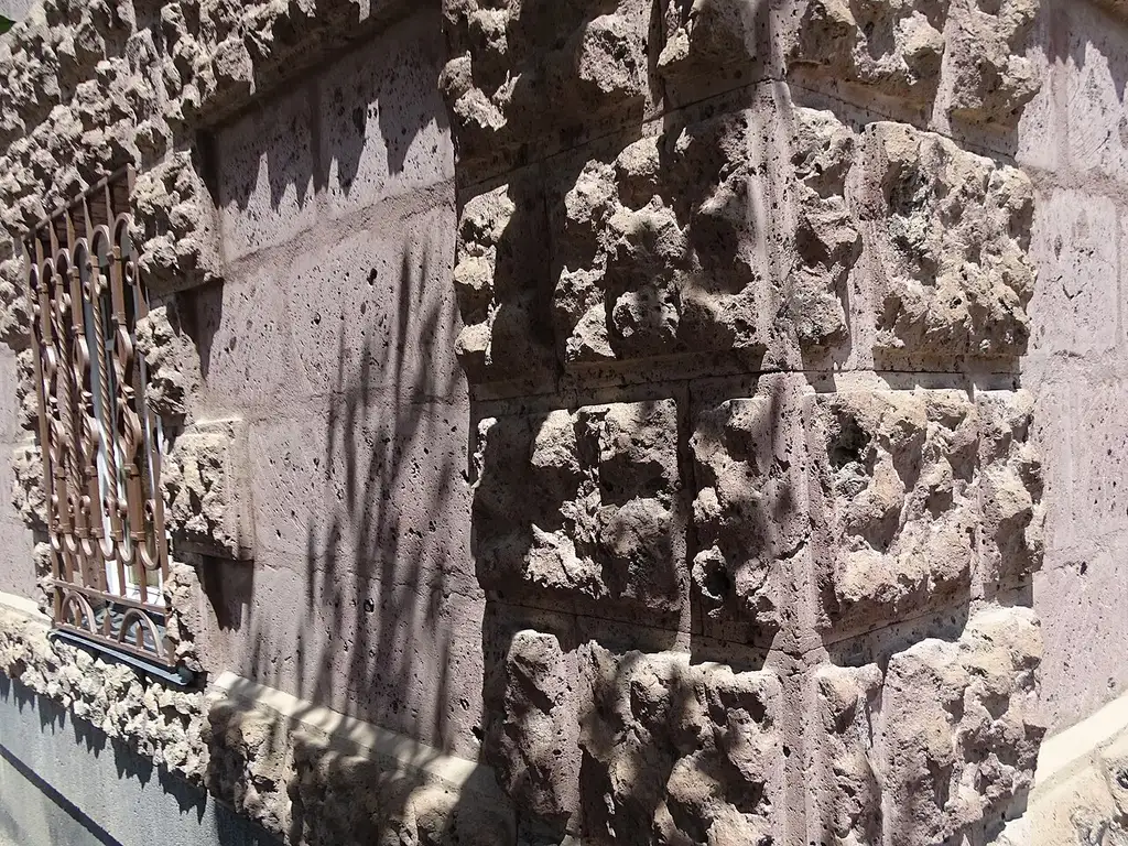 The carved stone facade of a 19th-century house in the Kumayri historic district of Gyumri