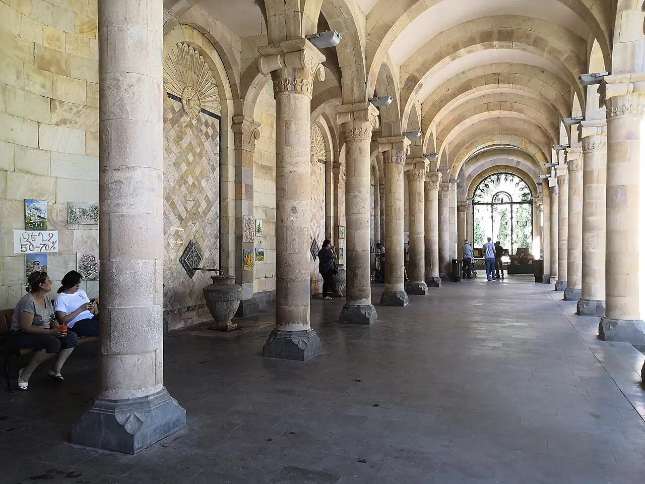 The columned interior corridor of the Jermuk drinking gallery where taps dispense mineral water at different temperatures