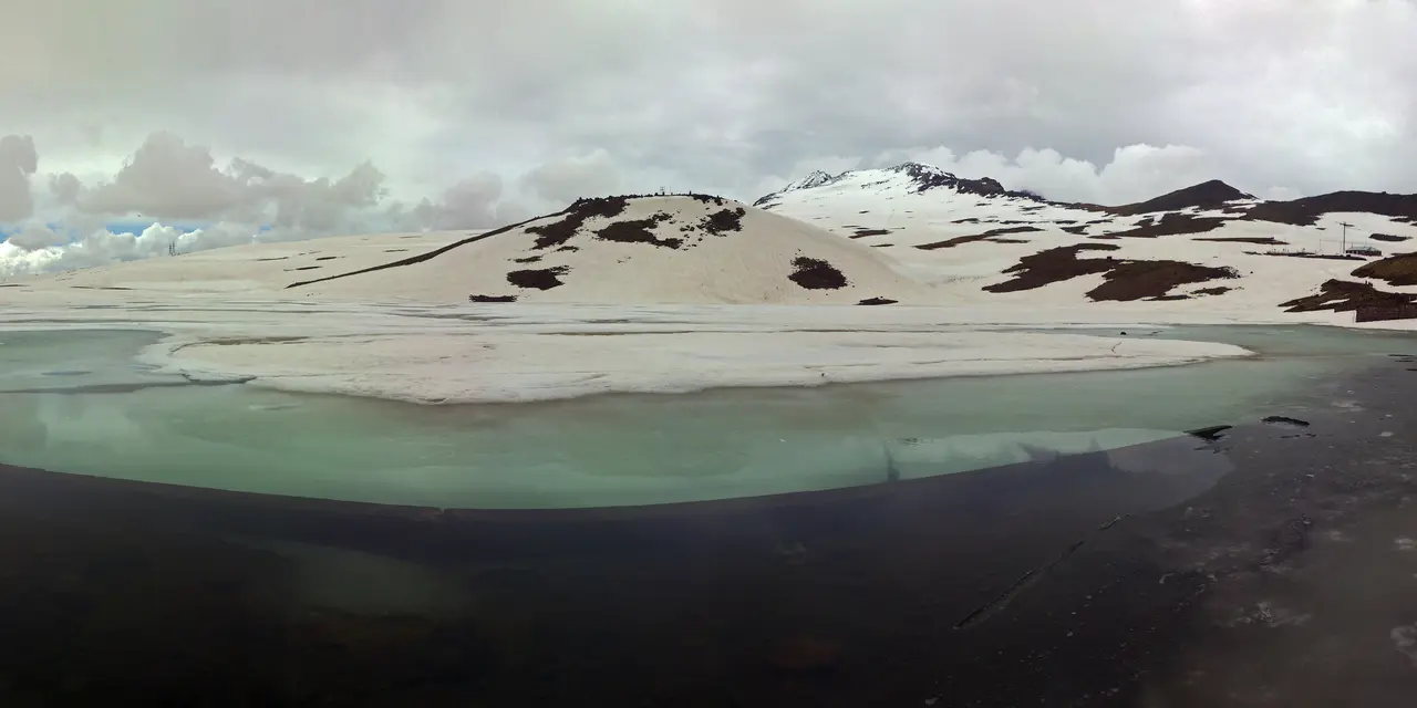 The still alpine water of Lake Kari on the upper slopes of Mount Aragats