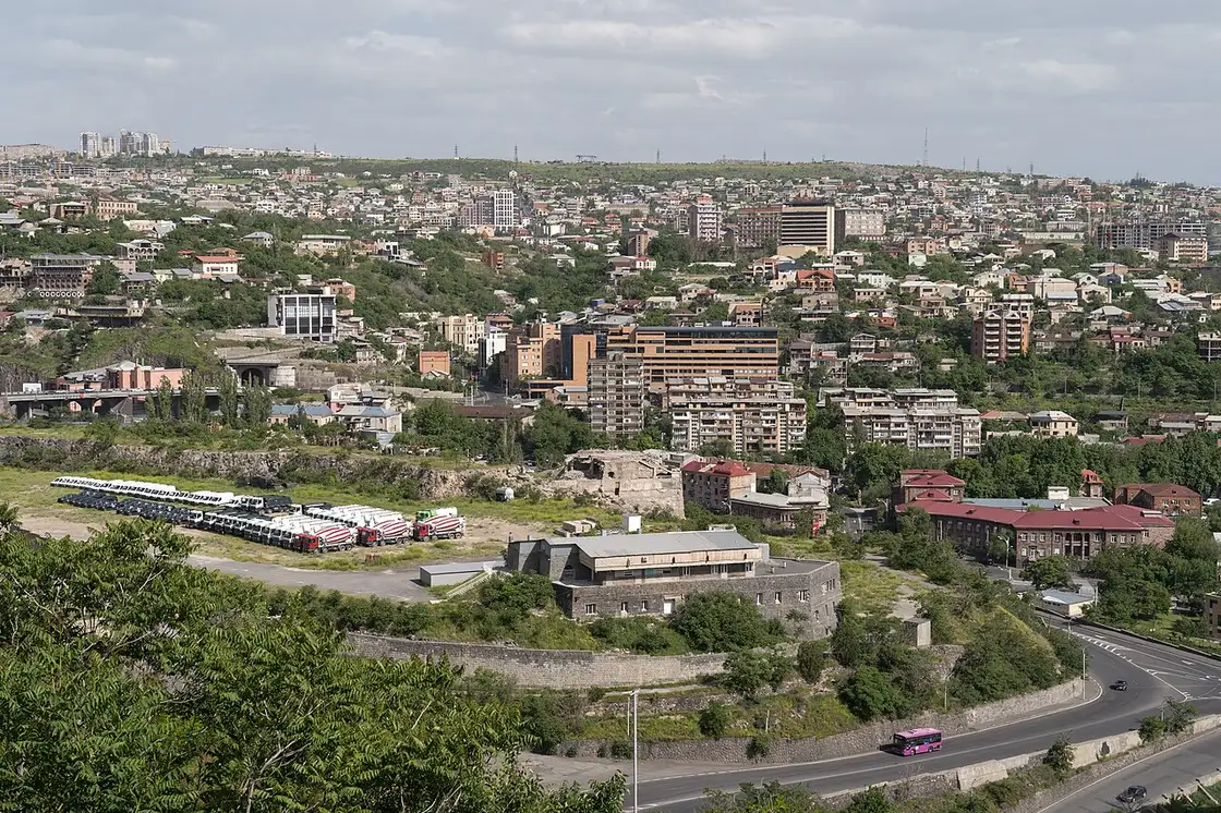 A wide view over the houses and apartment blocks of Yerevan from the Mother Armenia hill