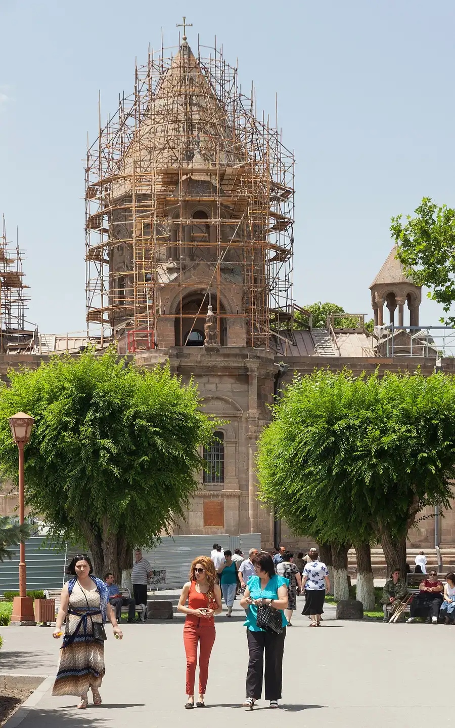 People standing in front of the Mother Cathedral of Echmiatsin on a bright day
