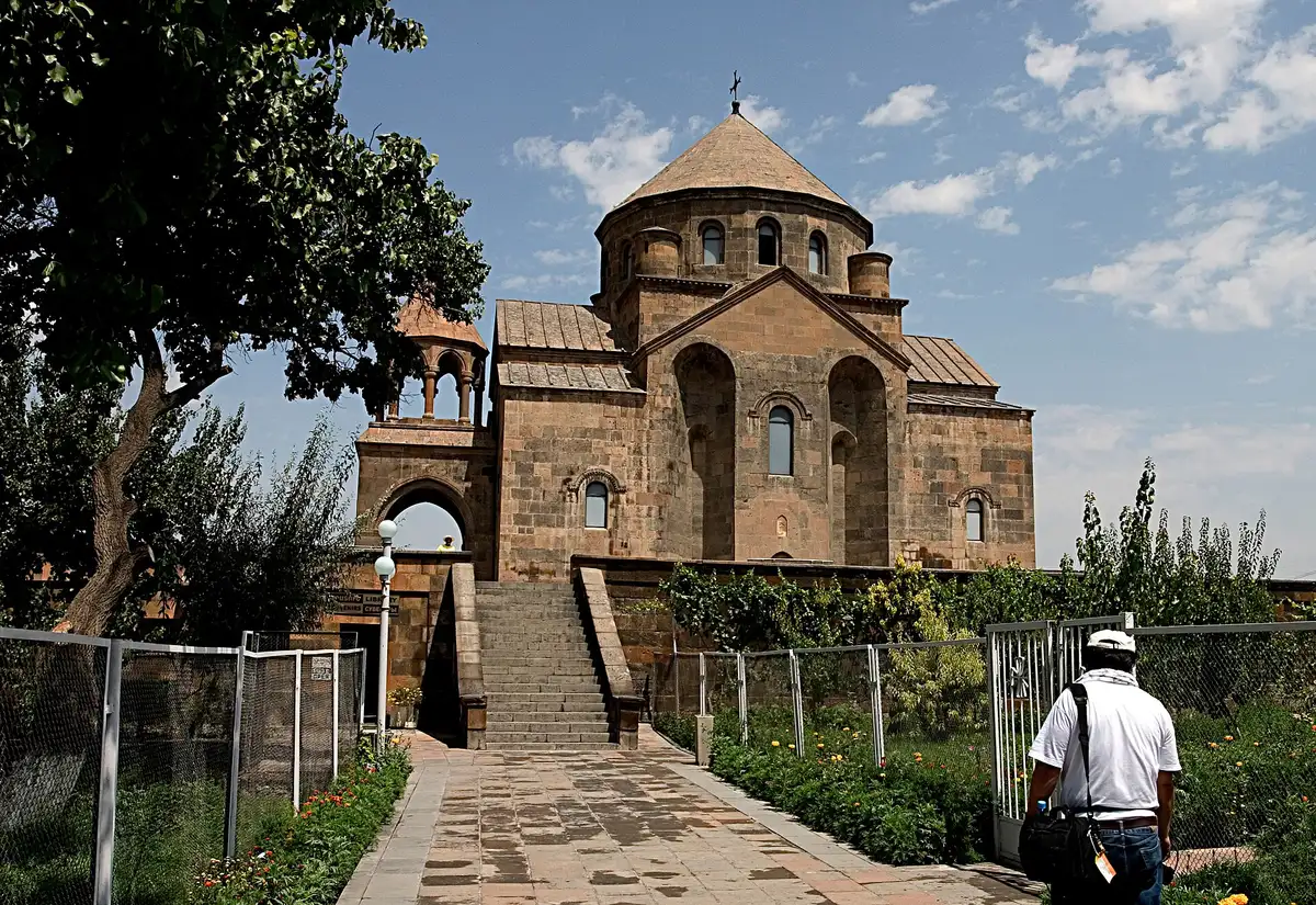 Saint Hripsime Church seen from below, showing its cross-shaped plan and corner turrets