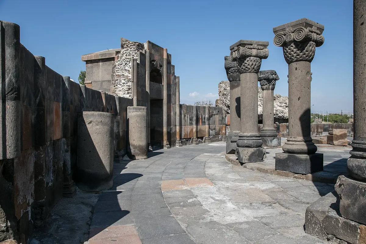 The circular ruins of Zvartnots Cathedral with re-erected columns on the plain near Vagharshapat