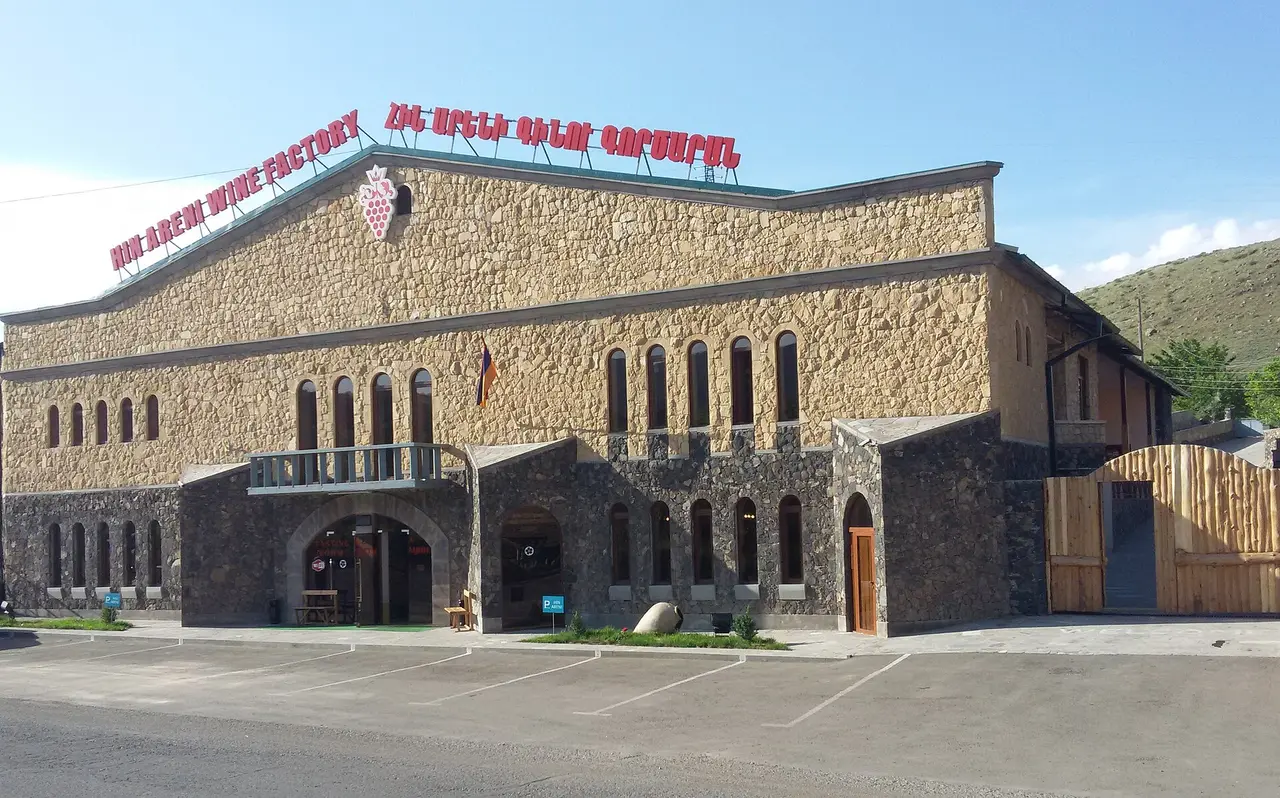 The stone and glass facade of Hin Areni winery beside the main road through Areni village