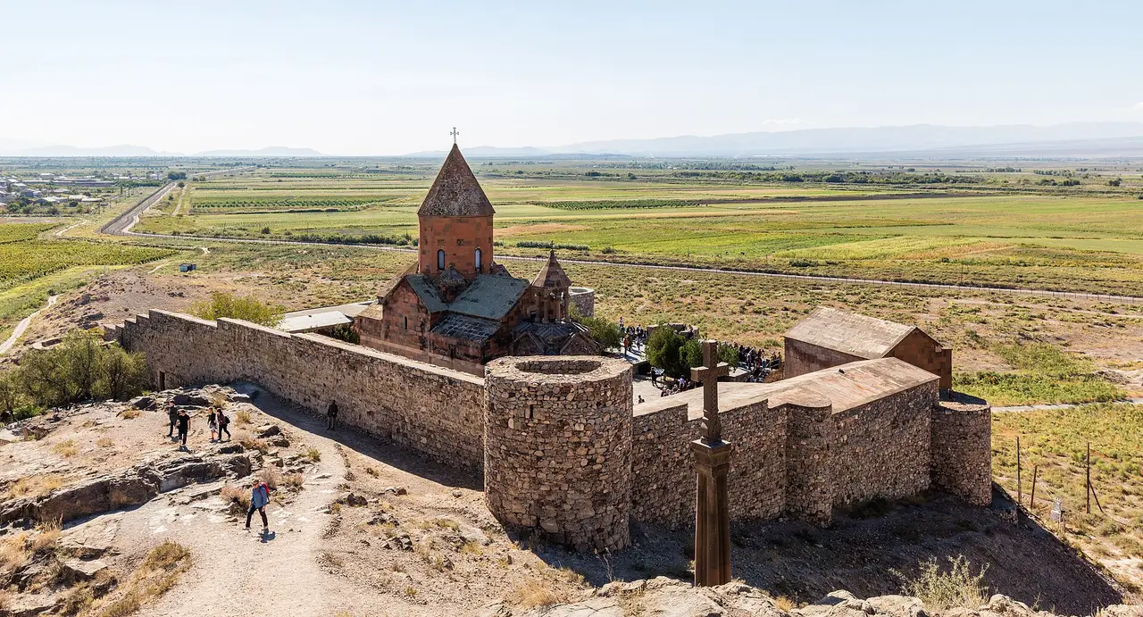 Khor Virap monastery on its low hill with Mount Ararat rising across the Ararat plain