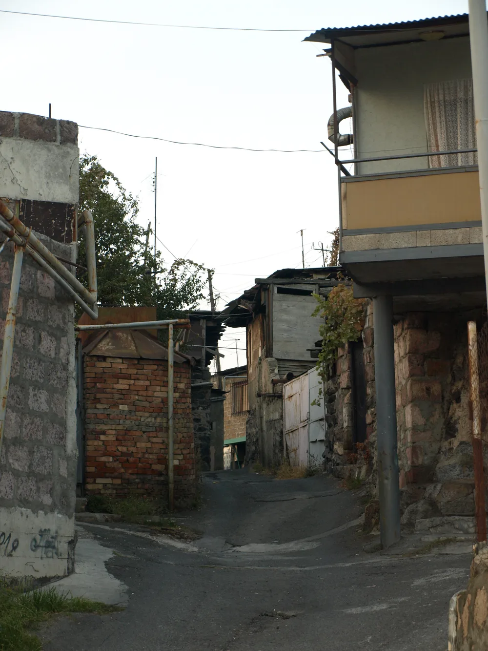 A narrow stepped lane between old houses in the Kond historical district of Yerevan