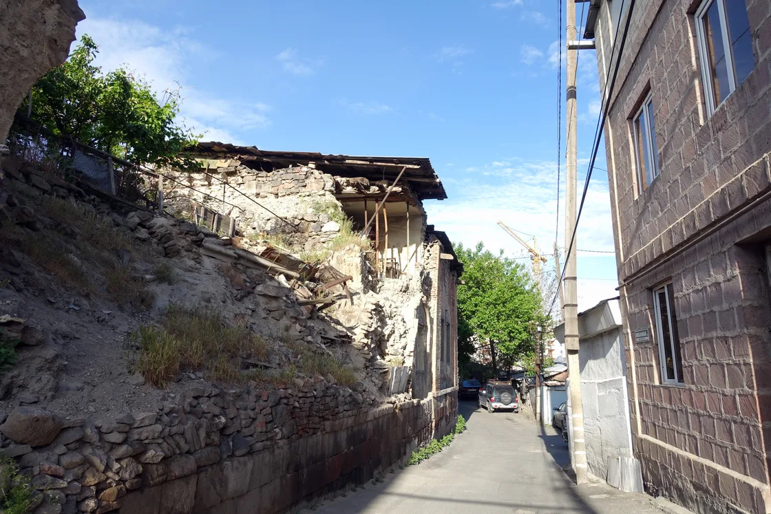 The tin roofs and stone houses of the old Kond quarter climbing a hill in the middle of Yerevan
