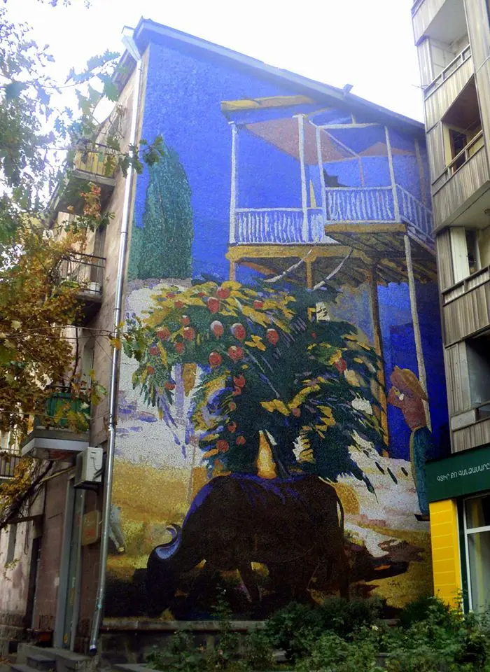A large painted mural covering the side of a building on Saryan Street in Yerevan