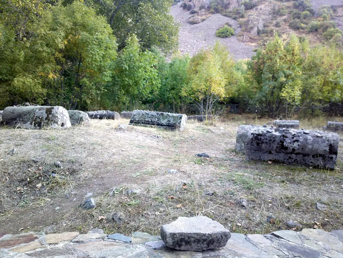 Carved medieval tombstones lying in the grass at the 13th-century Jewish cemetery near Yeghegis