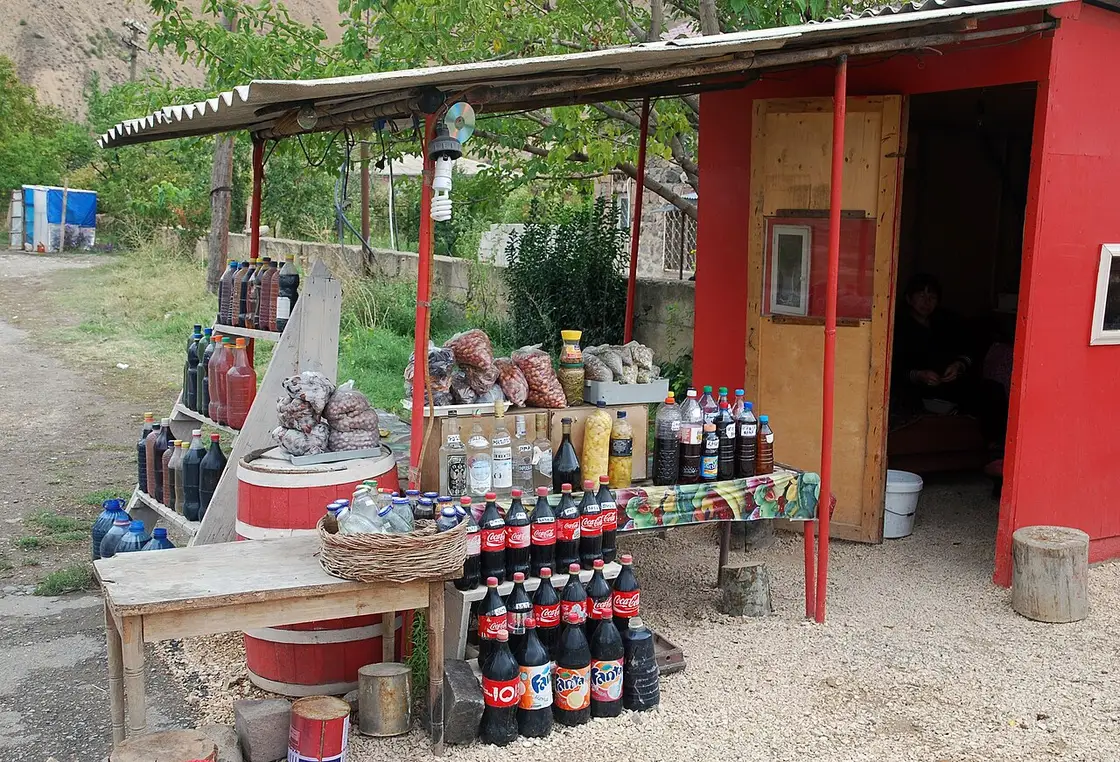 Bottles and jugs of local Areni wine on sale at a roadside stall in Vayots Dzor