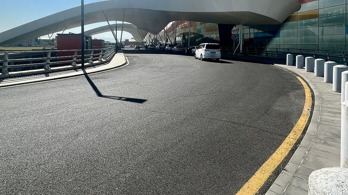 The sweeping white canopy over the departures and arrivals roadway at the modern terminal of Zvartnots International Airport near Yerevan