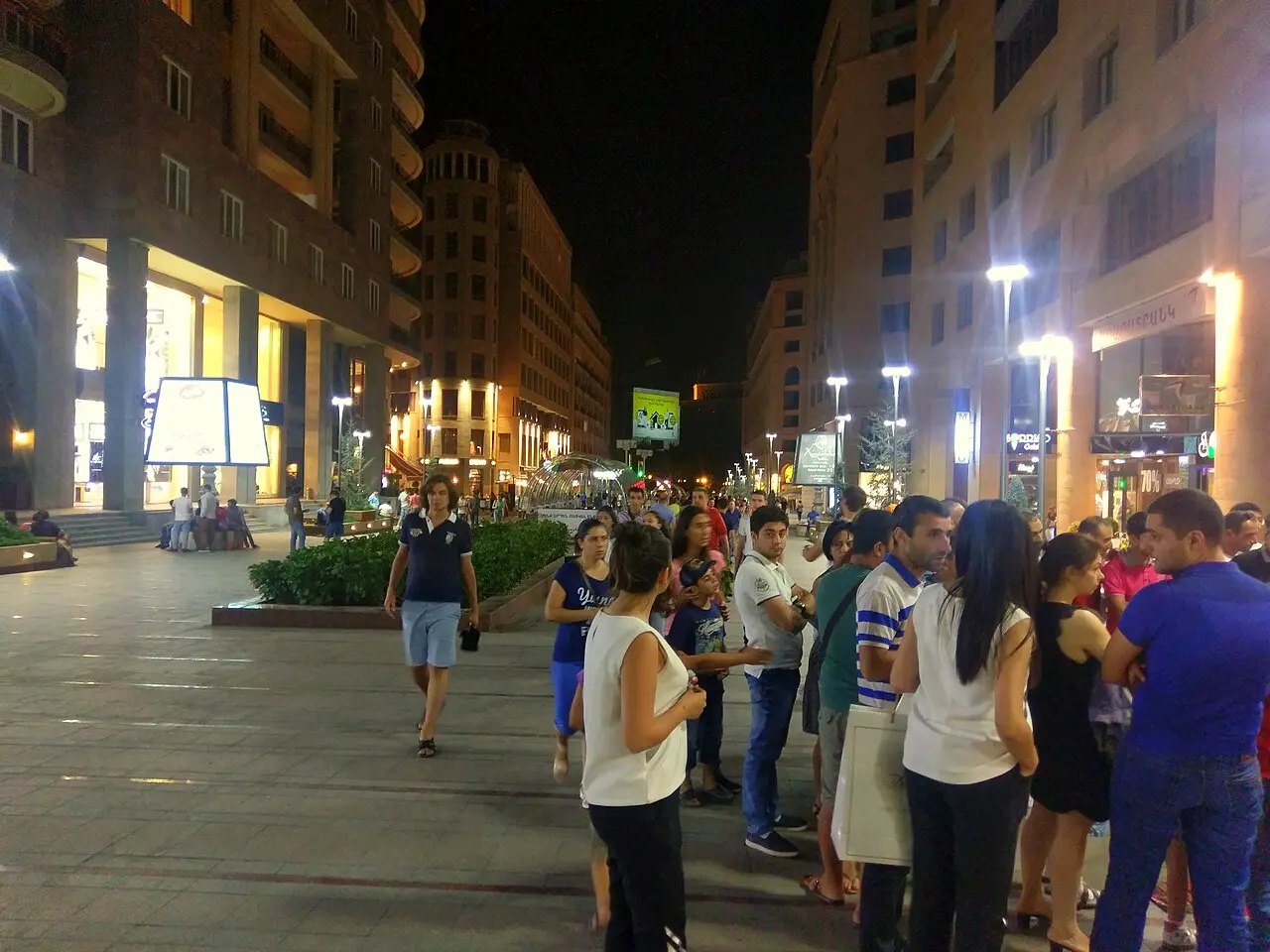 Northern Avenue in Yerevan busy with evening pedestrians and shop lights