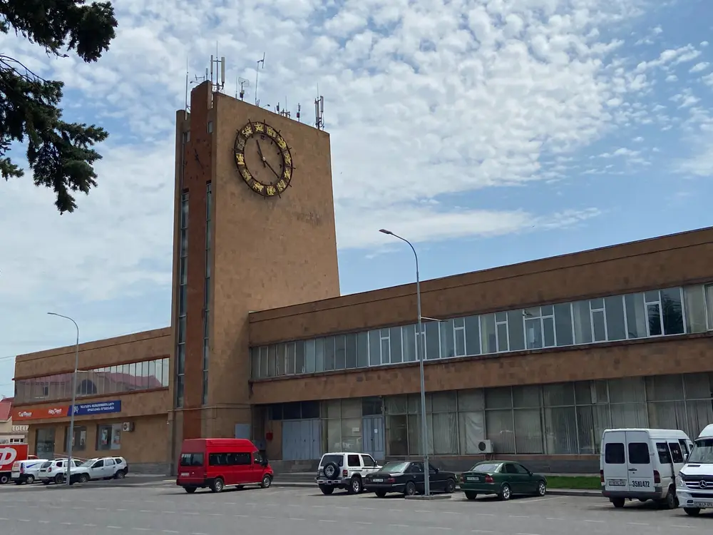 The platform and station building at Gyumri train station on a summer day