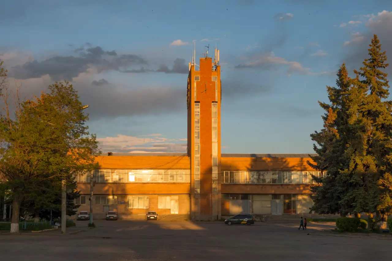The grand stone facade of Gyumri railway station under a blue sky