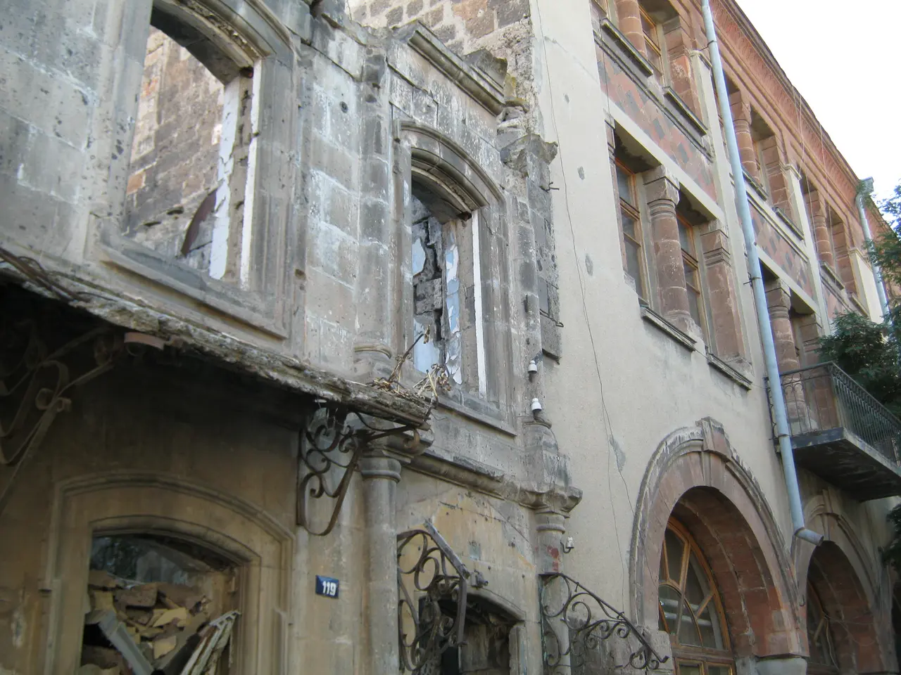 A quiet street of restored 19th-century stone houses in the Kumayri historic district of Gyumri