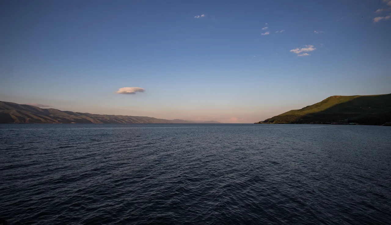 The wide blue expanse of Lake Sevan stretching to bare mountains on the far shore